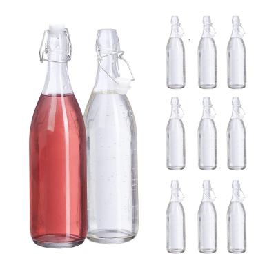 China 1L Empty Refillable Beverage Water Juice Liquor Wine Glass Bottle With Swing Cap for sale