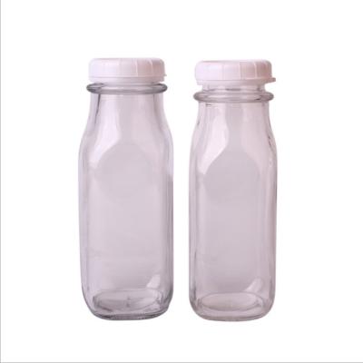 China Beverage 350ml 12oz Square Dairy Milk Glass Bottle With Tamper Proof Lid for sale