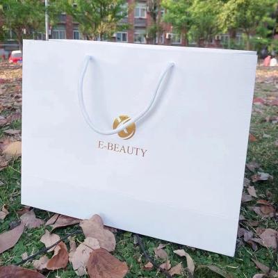 China Recyclable Factory Customized Ladies Gift Bags Clothing Paper Shopping Bags With Logo Printed for sale