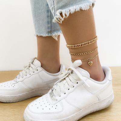 China FASHIONABLE Soft Simple Geometric Stacking Beach Heart Pendant Anklet Chain Set Hollow Metal Gold Plated Foot Chains Accessory for sale