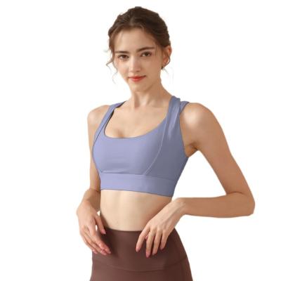 China Breathable Gym Women Push Up Wireless Padded Criss Cross Strappy Running Yoga Workout Crop Tops High Intensity Sports Bra for sale