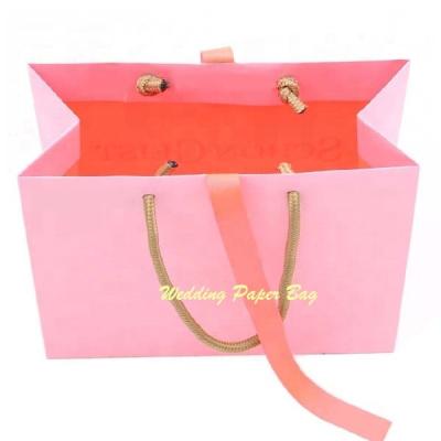 China Recyclable Gold Foil Logo Christmas Gift Bags Packaging Pink Rose Boutique Clothing Bag Custom Printing Paper With Rope Handle for sale