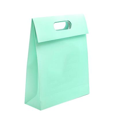 China Customized Printed Logo Recyclable Die Cut Gift Bag Heavy Duty Kraft Paper Envelope Handle Boutique Blue Shopping Bags With Cover Flap for sale