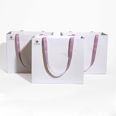 China Luxury Boutique Paper Shopping Bag Logo Printing Recycled Shopping Packing Recyclable Custom Paper Gift Bag for sale