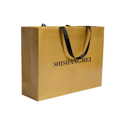 China Recyclable custom logo gold shopping with grosgrain ribbon handle boutique clothing retail textured paper bag for sale