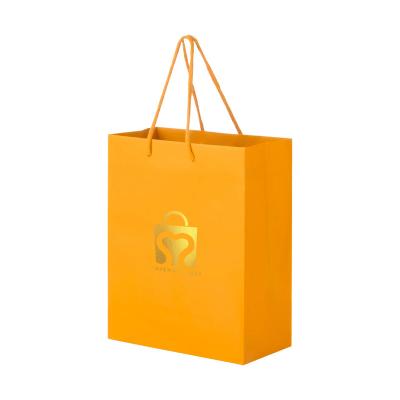 China Custom Recyclable With Logo Printing Gold Foil Holiday Kraft Paper Bag For Jewelry Cosmetics Shoes Packaging for sale