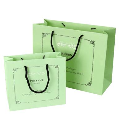 China Recyclable High Quality 250 Grams Printing Green Low Money Foil Gift Cosmetic Paper Bag With Your Own Logo for sale