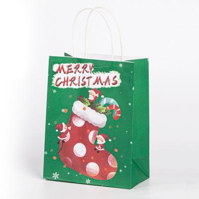 China Recycled Materials With Handles Craft Party Wrapping Bag Cartoon Custom Christmas Kraft Paper Gift Shopping Paper Bag for sale