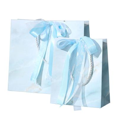 China Medium Size Recyclable Custom Boutique Art Print Arch Wedding Gift Packaging Bags Marble Light Blue Paper Bag With Ribbon Handles for sale