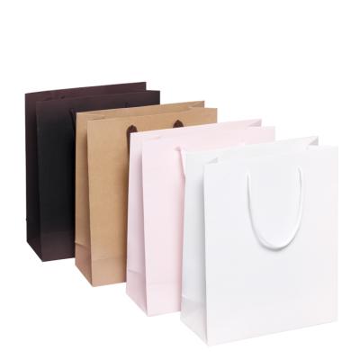 China Best Selling High Quality Recyclable Geometric Design 210gsm C1S Paper Gift Bags With Flat Paper Handles Custom Handmade Customized for sale