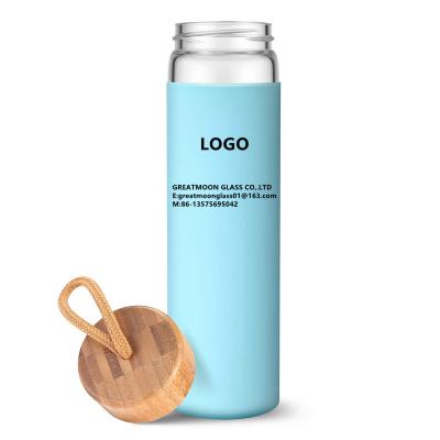 China High Quality Eco Friendly Sustainable Borosilicate Glass Bottle Clear Water Bottles With Bamboo Lid for sale