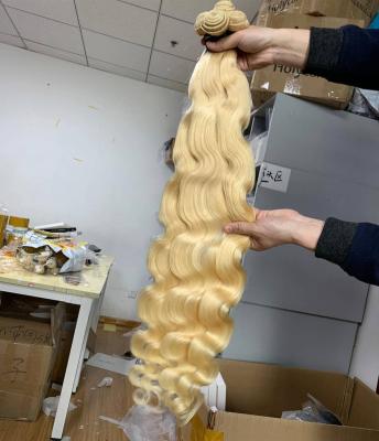 China 100%virgin hair silky straight wave ishe hair 613 no shedding no tangle free shipping wholesale price body wave bundlle with closure for sale