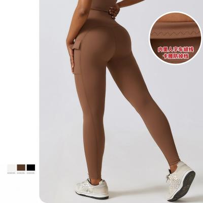 China Seamless Nude Quick-Drying Yoga Pants High-Waisted Hip Lift Fitness Sport Leggins Cargo Pocket Cycling Running Pants for sale