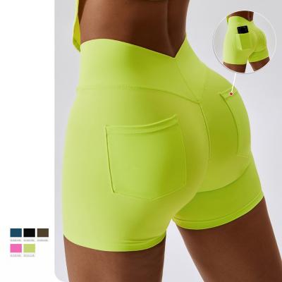 China Seamless Summer Yoga Shorts Cargo Pocket Casual Tight Shorts Hip Lift Fitness Women Biker Shorts for sale