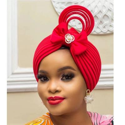 China Aso Oke Latest Aso Oke Fashion Bow Tie Hood Rhinestone Turban Nigerian Head Cap Luxury Women Big Bow Headwrap for sale