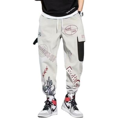 China Anti-wrinkle cartoon letter graffiti printed jumpsuits tube straight drawstring casual pants for sale