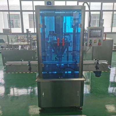 China New Design 4 Head Automatic Food Liquid Filling Machine Labeling Machine Packing Machine for sale