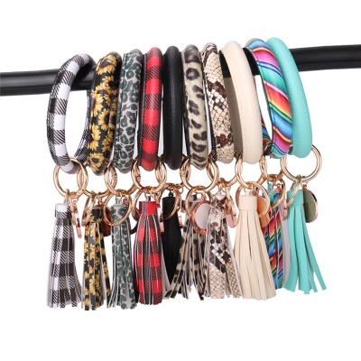 China Romantic Custom Printable PU Wristband Key Holder Sublimation Tassel Bangle Leather Wristband for sale