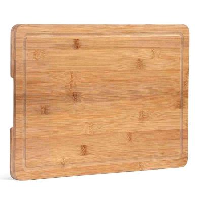 China Sustainable Bamboo Cutting Serving Board with Convenient Handles and Juice Groove for Serving for sale