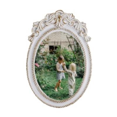 China Various Sizes Good Quality Custom Luxurious Vintage Resin Jigsaw European Style Frame Poster Photo Frame for sale