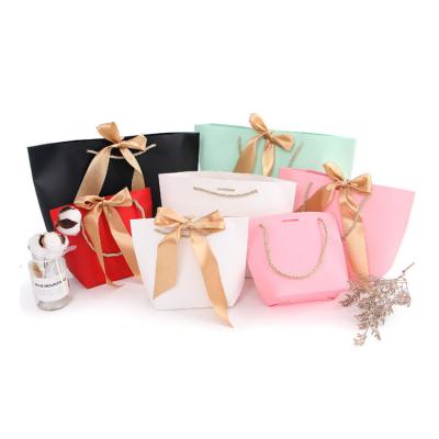 China Handmade Custom Wholesale Carrier Bags Brand Clothing Packaging Retail Store Shopping Paper Bags For Jewelry for sale