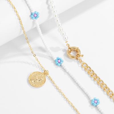 China FASHIONABLE retro simple metal portrait pearl necklace imitation small Daisy Flower Bead Necklace bohemian for sale