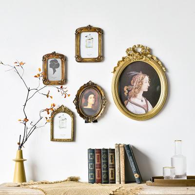 China Literary Wooden Photo Frame Wall Hanging Home Decoration Resin Retro Picture Frame Light Luxury Die-Cut Decoration for sale