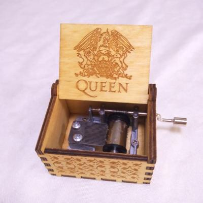 China OEM New Arrival Hot Selling Carved Wooden Hand Crank Music Box Queen With Rhapsody Bohemian Song for sale