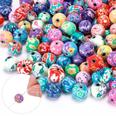 China Unisex Colorful 10mm Round Polymer Clay Beads Assorted Pattern Loose Beads Handmade Clay Beads Kit For Bracelet Making for sale