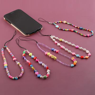 China Mobile phone lanyard chain for DIY fun creative Bohemian soft pottery smiling face new version easy lifting beaded acrylic mobile phone lanyard chain for sale