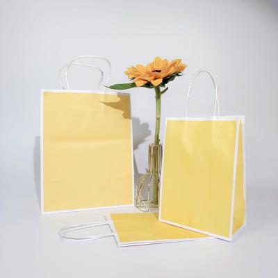 China Recycled materials wholesale OEM custom gift shopping package paper bags with your own logo for sale