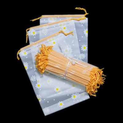 Cina Wholesale Disposable Beautiful Flower Nylon Drawstring Plastic Bag For Clothing Package in vendita