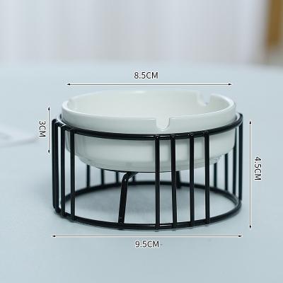 China Unique Stake Cigar Ash Ceramic Iron Ashtrays Creative Home Ashtrays For Cool Weed Ashtrays With Black Geometric Octagon Holder for sale