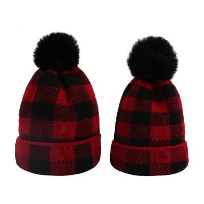 China COMMON Mother and Baby Knitted Christmas Hats Red Buffalo Plaid Winter Beanie Hat Family Matching Pom Pom Hats for sale