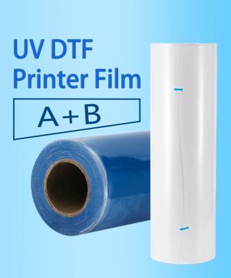 China Película de transferencia de película en rollo UV DTF Película de transferencia de película de PET UV DTF Película AB Textiles Alta transferencia de calor para impresora UV en venta