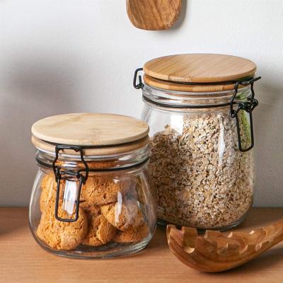 China Hot Selling Freshness Preservation Round 500ml Glass Storage Jars With Airtight Bamboo Wooden Lids For Food Storage for sale