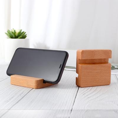 China Hot Sale Lower Prices Universal Mobile Phone Holder Professional Natural Natural Desktop Stand Solid Wood Waterproof for sale