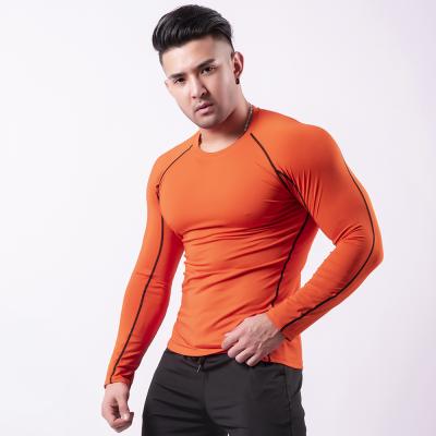 China Fashion New Men's Gym T-Shirt Solid Color Long Sleeve Men's Jogging Polyester Sports Breathable Compression Long Sleeve for sale