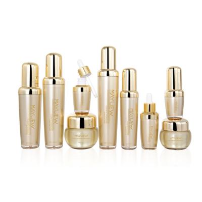 China Luxury Gold Cosmetic Airless Cream Spray Plastic Cosmetic Packaging Bottles With Pump for sale