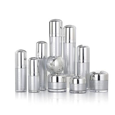 China Wholesale Elegant Empty Cosmetic Silver Cosmetic Containers Plastic Cream Bottles With Pump for sale