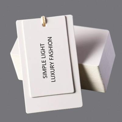 China 300g Viable Luxury Customized Printed Folding Hat Hang Tag With String Garment Label Design Printing Gift Paper Card Clothes for sale