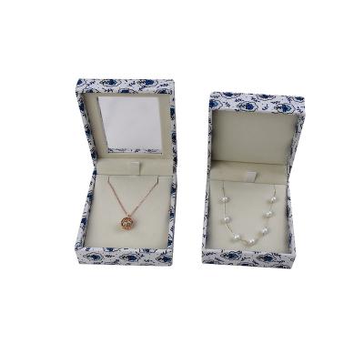 China Hot Selling Handmade Manufacturer Flower Pattern Necklace Packaging White And Blue Box With PVC Window for sale