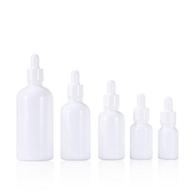 China 15ml 20ml 30ml 50ml Cosmetic Pearl Dropper Bottle Essential Oil White Glass Bottle With Cap for sale