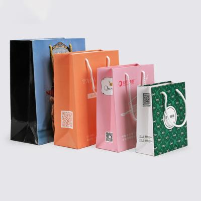 China Hot Selling Custom Paper Bags Recycled Materials Gift Packaging Bag Shopping With Your Own Logo White Black Brown Kraft Paper Suitcase for sale