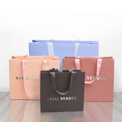 China Recycled Materials Wholesale Printed Logo Luxury Paper Bag Fashion Retail Boutique Shopping Gift Hot Stamping Paper Bags With Custom Your Own Logo for sale