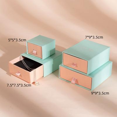 China New Arrival Custom Logo Jewelery Box Packaging Texture Recyclable Blue Pink Cardboard Paper Jewelery Slipping Gift Boxes For Small Business for sale