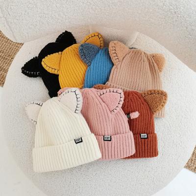 China COMMON Wholesale Custom Embroidery Woven Label Unisex Pure Color Winter Knitted Hats Winter Beanies for sale