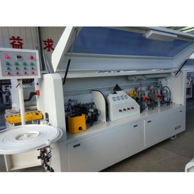 Cina Full automatic PVC edge banding machine KC307D with gluing end cutting rough  fine trimming scraping buffing functions in vendita