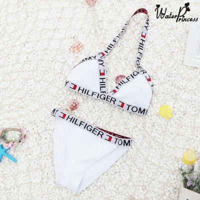 China Women Solid Color Slit Bikini Letter Swimwear Wholesale Breathable Stain Swimsuit for sale