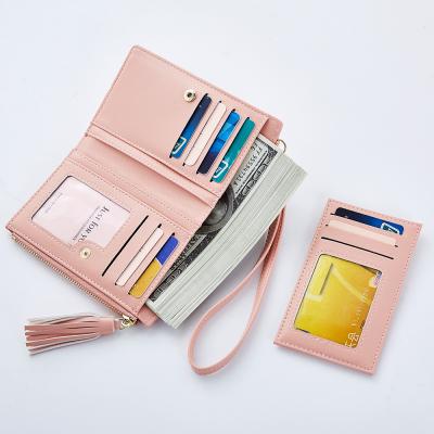 China Anti-theft Women's Long Clutch Wristlet Purse Travel Tassel Wallet with Small Mirrors and ID Window for sale